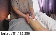 Natural medicine, reflexology, woman getting calf massage, depressing energy points, spa center. Стоковое видео, видеограф Владислав Тригуб / Фотобанк Лори