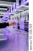 Exploring Innovative Display Technology: A Close-Up of Hands Interacting with Transparent Screens in a Modern Retail Environment. Стоковое AI-изображение, AI-художник Владимир Федоров / Фотобанк Лори