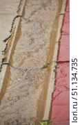 A concrete gutter with a stream of rainwater and red paving slabs on the side. Slow motion of rain. A trickle of water flows through a storm drain. Стоковое видео, видеограф Воловодов Владимир / Фотобанк Лори