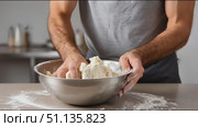 Baker kneading dough in metal bowl, showcasing traditional bread making skill with precise hand movements and professional technique. Стоковое AI-видео, аниматор Юрий Поздников / Фотобанк Лори