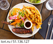 Juicy roasted duck magret served sauce framboise, french fries and vegetables. Стоковое фото, фотограф Яков Филимонов / Фотобанк Лори