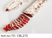Sliced Catalan dry cured sausage Fuet. Стоковое фото, фотограф Яков Филимонов / Фотобанк Лори