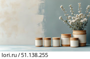 Eco Wooden Jars on Vintage Blue Background. Стоковое AI-изображение, AI-художник Анна Никонорова / Фотобанк Лори