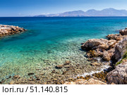 Agios Nikolaos coastline on a sunny day with clear sea and cliffs. (2019 год). Стоковое фото, фотограф Емельянов Евгений Викторович / Фотобанк Лори