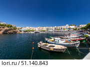 AGIOS NIKOLAUS, GREECE - SEPTEMBER 10, 2019: Lake Vulismeni with boats in the foreground. Редакционное фото, фотограф Емельянов Евгений Викторович / Фотобанк Лори