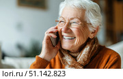 Пожилая женщина разговаривает по телефону. An elderly woman is talking on the phone. Стоковое AI-изображение, AI-художник Смирнова Светлана / Фотобанк Лори