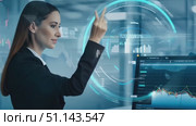 A woman monitors and interprets financial charts while working diligently at her desk in a corporate office. Стоковое AI-видео, аниматор Данила Большаков / Фотобанк Лори