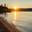 Baikal Lake on summer sunset. View of pebble beach of Olkhon Island on quiet August evening. Picturesque seascape. Natural background. Summer travel. Стоковое фото, фотограф Виктория Катьянова / Фотобанк Лори