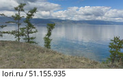 Video of summer landscape of Baikal Lake on sunny August day. View of Small Sea from Olkhon island coast. Natural background. Summer travels and outdoor recreation. Стоковое видео, видеограф Виктория Катьянова / Фотобанк Лори