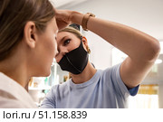 Beauty Transformation Underway in a Cozy Salon as a Woman Receives Expert Makeup Application. Стоковое фото, фотограф Aleksandr Golubev / Фотобанк Лори