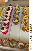 Close up delicious dessert pastry cakes. Fresh colourful sweet berry desserts, beautifully decorated in Egypt Large platters of middle eastern sweets dessert, baklava, pastry, honey, nuts, celebration feast in Egypt  Sweet table with Baklava, layered pastry dessert made of filo pastry sheets, Стоковое видео, видеограф Zita Khasanova / Фотобанк Лори