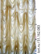 curtain drape of fabric hanging on the window. Стоковое фото, фотограф Наталия Кирсанова / Фотобанк Лори