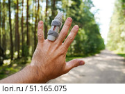 Man showing injured finger with splint in forest road. Стоковое фото, фотограф Дмитрий Цветков / Фотобанк Лори