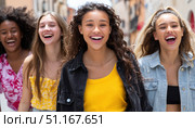 Multiethnic women friends strolling together, sharing laughter while navigating urban sidewalk, expressing genuine joy during sunny summer day. Стоковое AI-изображение, AI-художник Юрий Поздников / Фотобанк Лори