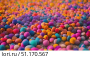 Wide array of colorful balls of different sizes and colors, creating a vibrant and visually striking scene. Стоковое AI-видео, аниматор Данила Большаков / Фотобанк Лори