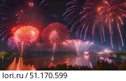 Vibrant fireworks burst and illuminate night sky with dazzling colors, creating a spectacular visual display. Стоковое AI-видео, аниматор Данила Большаков / Фотобанк Лори