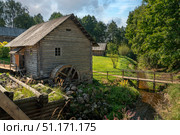 Watermill Museum on the territory of the Pushkin village in Bugrovo of the Pushkin Museum-Reserve on a sunny summer day, Pushkinskiye Gory, Pskov region, Russia. Стоковое фото, фотограф Ula Ulachka / Фотобанк Лори