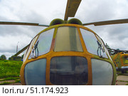 An old Soviet MI-8 combat helicopter. A close-up of the cabin from the front. Belarus. Minsk. 09.08.2025. Редакционное фото, фотограф Ярославский Максим / Фотобанк Лори