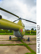 An old Soviet MI-2 small combat helicopter under a gloomy sky. Belarus. Minsk. 09.08.2025. Редакционное фото, фотограф Ярославский Максим / Фотобанк Лори