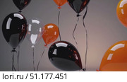 Close party cluster with rich reflections as black, orange and white helium balloons drift gently in a bright interior — polished 4K 16:9 slow-motion celebration shot. Стоковое AI-видео, аниматор Владислав Войтов / Фотобанк Лори