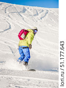 Sheregesh, Russia, 7 January 2017, Snowboarder skier sliding down snowy slope. Редакционное фото, фотограф Spirit River / Фотобанк Лори