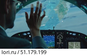 A pilot expertly maneuvers a flight simulator, engaging with a detailed landscape map and advanced cockpit instruments during dusk. Стоковое AI-видео, аниматор Данила Большаков / Фотобанк Лори