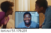Two friends engage in a lively conversation through a screen in a warm, inviting living space, filled with laughter and connection. Стоковое AI-видео, аниматор Данила Большаков / Фотобанк Лори