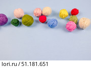 Multi-colored balls of thread are scattered on the table, knitting, embroidery, handwork. Стоковое фото, фотограф Alexandra Aleroewa / Фотобанк Лори