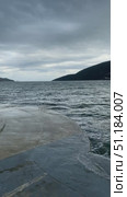 Overcast seascape with mountains and cloudy sky viewed from concrete pier background. Стоковое видео, видеограф Анастасия Золотницкая / Фотобанк Лори