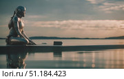 Robot sitting on edge of body of water, showcasing its unique design and capabilities in natural setting. Cyborg still as it overlooks water, fascinating glimpse into integration of tech and nature. Стоковое AI-видео, аниматор Данила Большаков / Фотобанк Лори