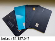 Flat lay of various modern debit and credit cards arranged in a fan pattern. Стоковое фото, фотограф Виктор Ветошкин / Фотобанк Лори