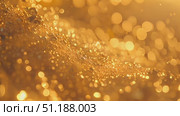 The shimmering droplets create a stunning golden bokeh effect, enhancing the warm atmosphere during sunset hours. Стоковое AI-видео, аниматор Данила Большаков / Фотобанк Лори