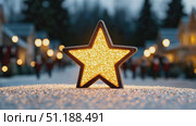 A glowing decorative star stands illuminated on a snow-covered street during the evening, surrounded by festive bokeh lights and blurred silhouettes of houses and people in the background. The image evokes a cozy holiday atmosphere, perfect for capturing the spirit of Christmas and New Year celebrations in a charming winter town. Стоковое AI-видео, аниматор Ксения Чунаева / Фотобанк Лори
