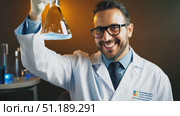 A scientist in a lab coat shares insights about his research while smiling confidently under warm lighting in an engaging atmosphere. Стоковое AI-видео, аниматор Данила Большаков / Фотобанк Лори