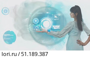 A woman dressed in a light outfit engages with advanced holographic technology, showcasing interactive displays in a contemporary environment. Стоковое AI-видео, аниматор Данила Большаков / Фотобанк Лори