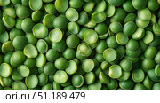 A Close-Up View of Vibrant Green Peas Piled Together Showcasing Their Glossy Texture and Unique Shapes in a Natural Arrangement. Стоковое AI-изображение, AI-художник Башкирова Анна / Фотобанк Лори