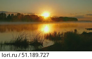 Landscape with sunrise on river in fog. Стоковое видео, видеограф Михаил Коханчиков / Фотобанк Лори