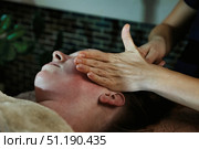 Relaxing Facial Massage Experience at a Spa Salon Promotes Rejuvenation and Wellness. Стоковое фото, фотограф Aleksandr Golubev / Фотобанк Лори
