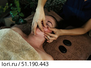 Relaxation Through Facial Massage Experiences in a Tranquil Spa Setting. Стоковое фото, фотограф Aleksandr Golubev / Фотобанк Лори