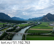 Inn river meandering through green valley in the Austrian Alps at dusk. Стоковое фото, фотограф Данил Руденко / Фотобанк Лори