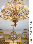 St. Petersburg, Russia - May 27, 2021: Hermitage Museum, large chandelier with gilding for hall lighting. Palace interior details. Редакционное фото, фотограф Наталия Кирсанова / Фотобанк Лори