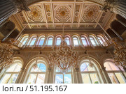 St. Petersburg, Russia - May 27, 2021: Hermitage Museum, large chandelier with gilding for hall lighting. Palace interior details. Редакционное фото, фотограф Наталия Кирсанова / Фотобанк Лори