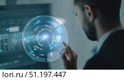 A professional engages with cutting-edge data analytics technology in a modern office environment, showcasing advanced visualization techniques. Стоковое AI-видео, аниматор Данила Большаков / Фотобанк Лори