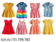 Colorful collection of baby dresses, isolated on a white background. Different styles and colors clothes for baby girls. Rainbow ruffle skirt, denim shirt top, party gown, cotton short-sleeve dresses. Стоковое AI-изображение, AI-художник Марина Демидюк / Фотобанк Лори