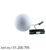 Opal glass sphere pendant lamp with cable connected to rectangular power module from lighting showroom. Стоковое фото, фотограф Татьяна Терехина / Фотобанк Лори