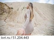 Follow me. Young attractive woman holding a mans hand. Стоковое фото, фотограф Андрей Аркуша / Фотобанк Лори