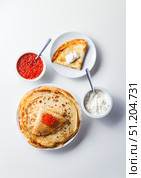 Stack of russian pancakes blini with red caviar, fresh sour cream. Стоковое фото, фотограф Ирина Буракова / Фотобанк Лори