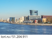 Saint-Petersburg, Russia - March 23rd, 2020. View of modern business center "Saint Petersburg Plaza" on Malookhtinsky Prospekt and Neva river embankment. Редакционное фото, фотограф Denis Vostrikov / Фотобанк Лори