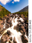 Aerial top view  Uchar Cascade waterfall in Altai Republic. Fall of water between large stones in forest, rocky mountains with a rainbow. Russia summer landscape 2025. Стоковое фото, фотограф Алексей Ширманов / Фотобанк Лори