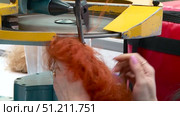production of dolls at the toy factory hair extensions and coloring of blanks. Стоковое видео, видеограф Алексей Сергеев / Фотобанк Лори
